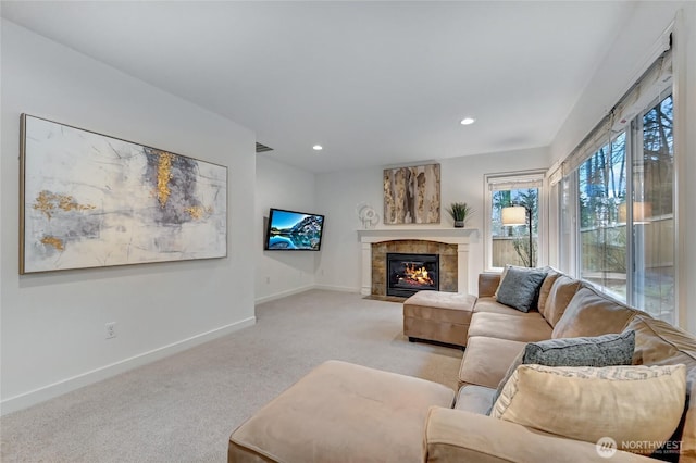 living room with visible vents, baseboards, light carpet, recessed lighting, and a tile fireplace