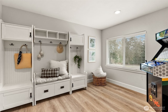 mudroom with baseboards and light wood-type flooring