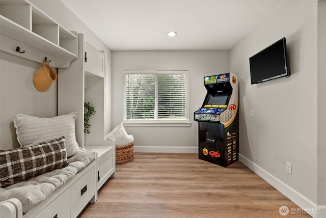 mudroom featuring recessed lighting, baseboards, and light wood finished floors