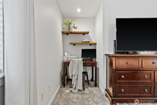 office space featuring light colored carpet and baseboards