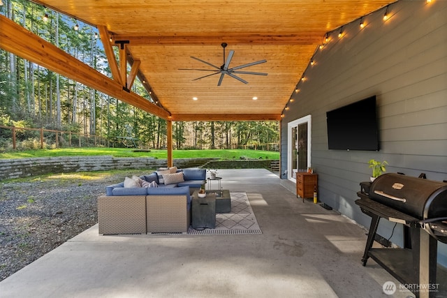 view of patio featuring a grill, an outdoor hangout area, a ceiling fan, and fence