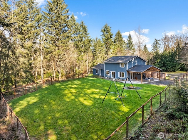 view of yard with a fenced backyard and a patio