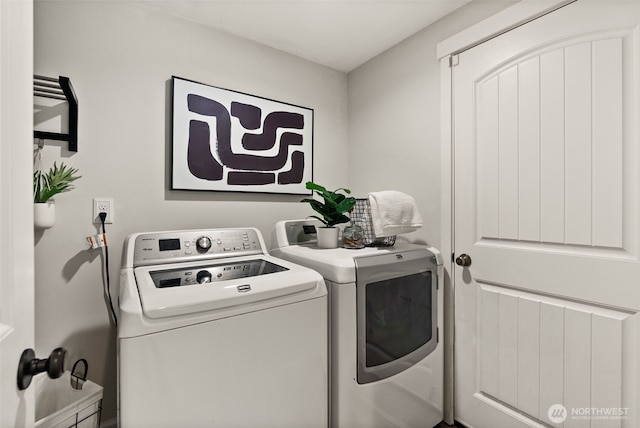 washroom featuring washer and dryer and laundry area