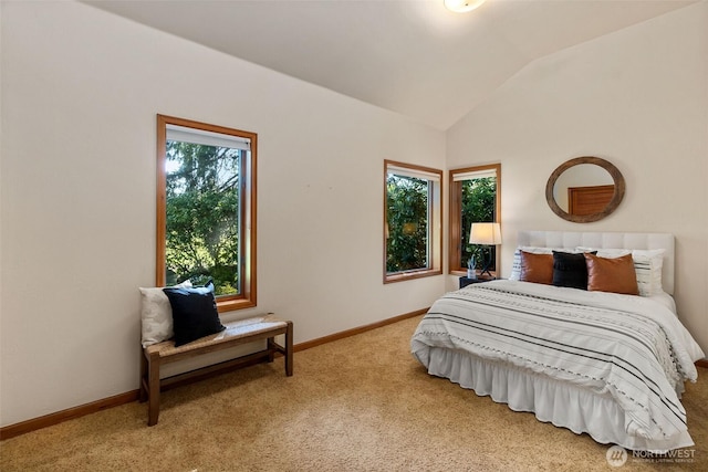 bedroom with baseboards, carpet floors, and vaulted ceiling