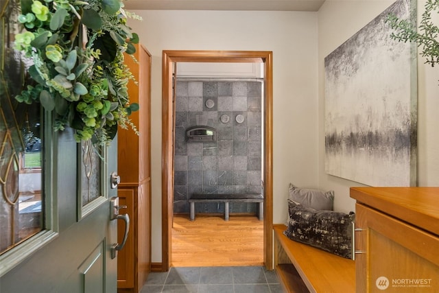 bathroom with tile patterned floors and a healthy amount of sunlight