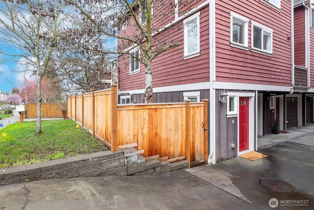 view of property exterior featuring fence