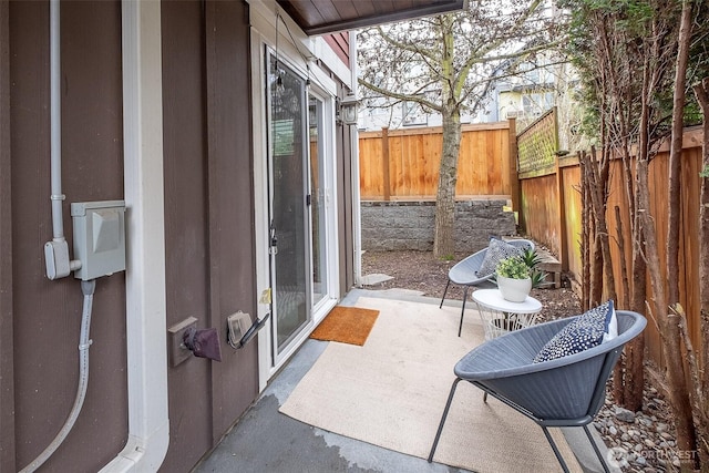 view of patio featuring fence