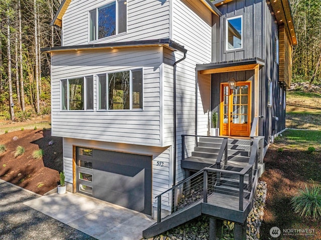 modern home featuring board and batten siding and an attached garage