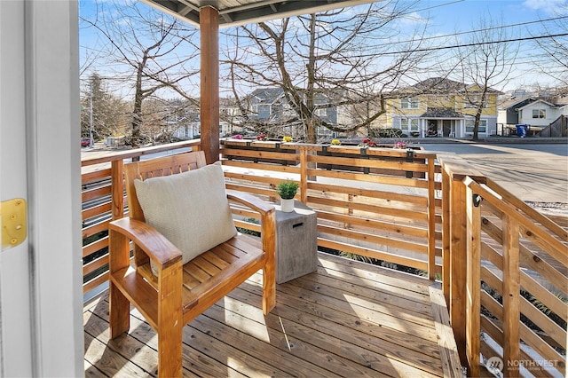 wooden terrace featuring a residential view