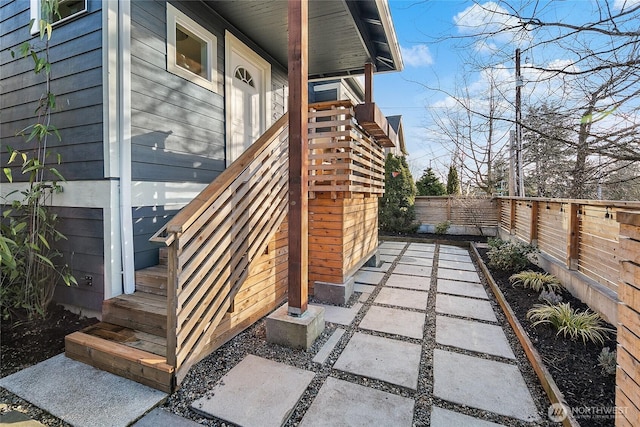 exterior space featuring entry steps and a fenced backyard