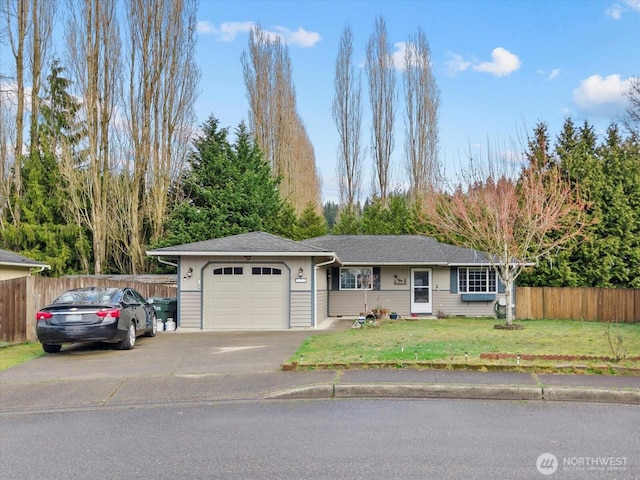 ranch-style home featuring a front yard, an attached garage, fence, and driveway