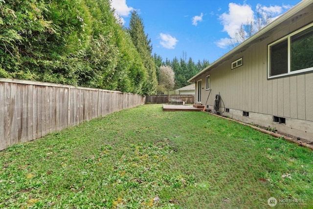 view of yard featuring a fenced backyard