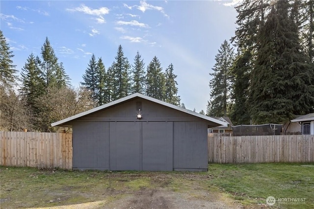 view of outdoor structure featuring an outdoor structure and fence