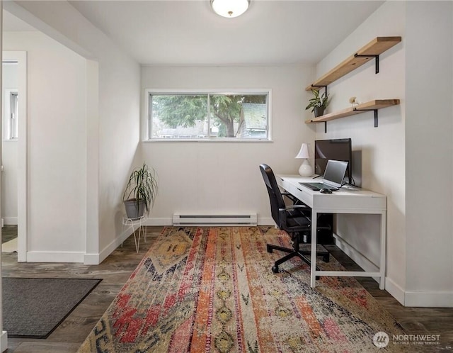 home office with a baseboard heating unit, baseboards, and wood finished floors