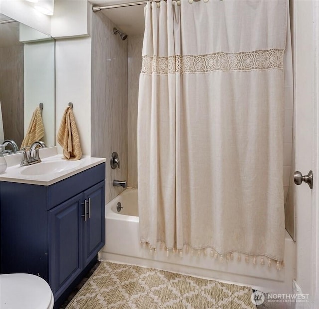 full bath with vanity, toilet, and shower / bath combo