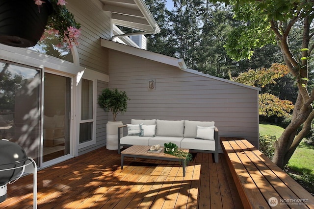 wooden deck with grilling area and outdoor lounge area