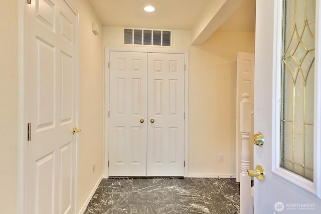 entryway featuring visible vents, marble finish floor, and baseboards