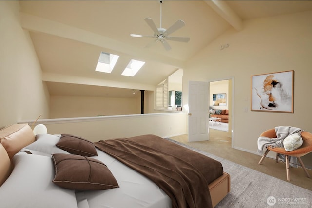 bedroom featuring vaulted ceiling with skylight, baseboards, carpet, and ceiling fan