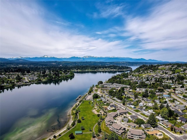 birds eye view of property featuring a water and mountain view