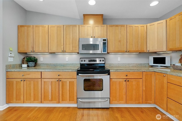 kitchen with recessed lighting, light wood-type flooring, and stainless steel appliances