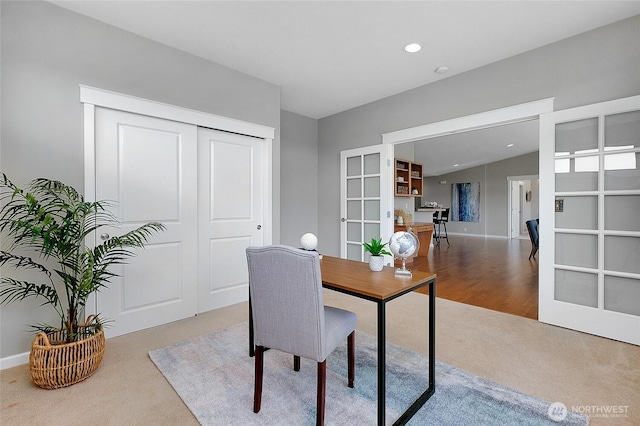 carpeted office space with recessed lighting and baseboards