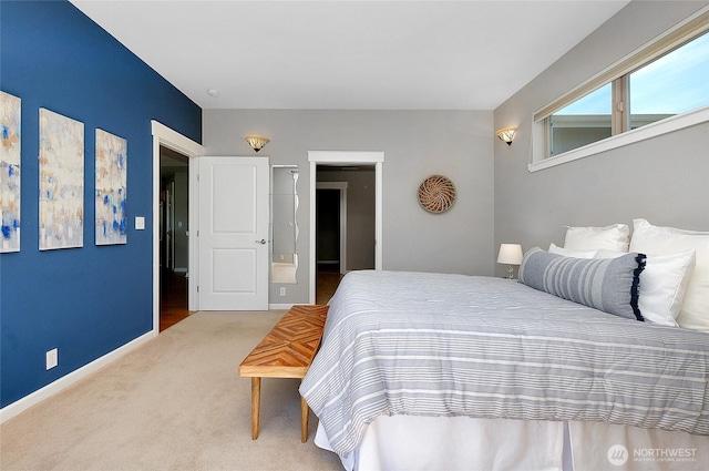 carpeted bedroom with baseboards