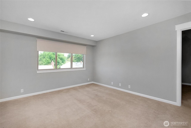 spare room featuring visible vents, recessed lighting, baseboards, and carpet floors