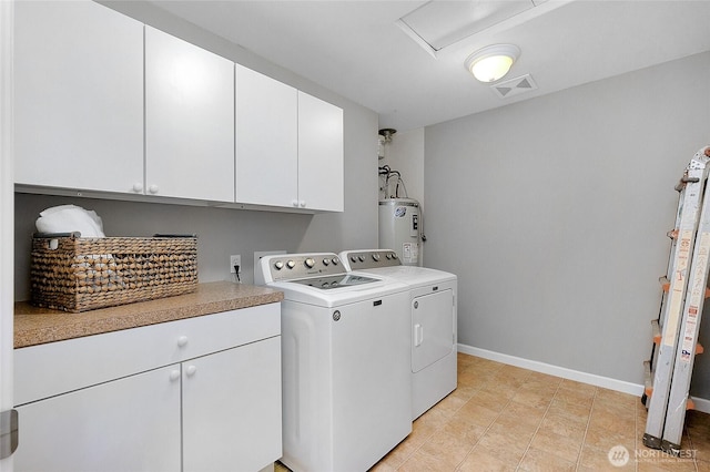 laundry area with washing machine and clothes dryer, visible vents, electric water heater, baseboards, and cabinet space