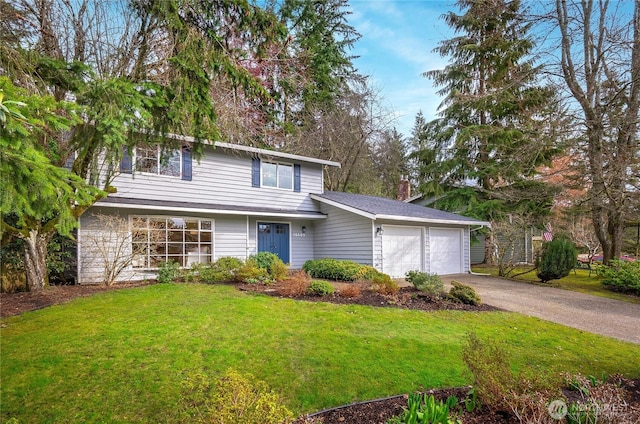 traditional-style home featuring aphalt driveway, a chimney, a front yard, and a garage