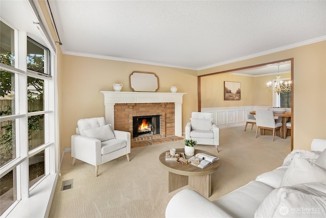 living area with carpet flooring, a brick fireplace, visible vents, and ornamental molding