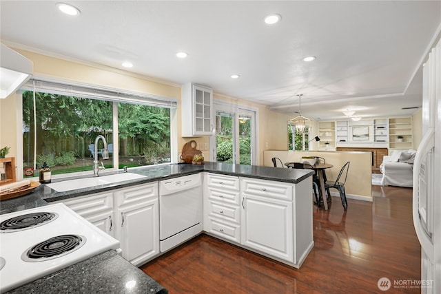 kitchen featuring a sink, white appliances, dark wood-type flooring, and white cabinetry