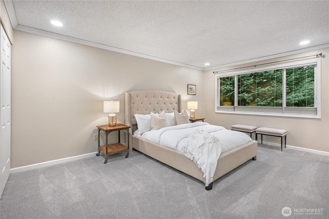 carpeted bedroom featuring ornamental molding, recessed lighting, baseboards, and a textured ceiling