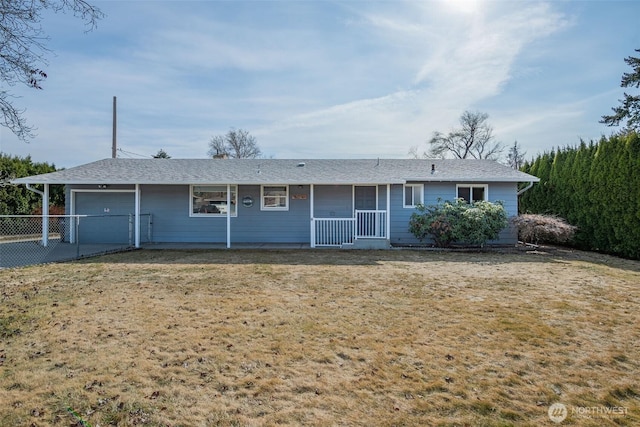 single story home featuring a front yard, a garage, and fence