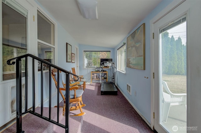 interior space with stairway, carpet flooring, baseboards, and visible vents