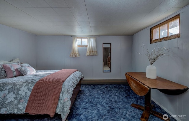 carpeted bedroom featuring a baseboard radiator