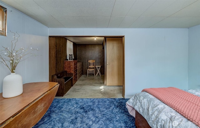 bedroom with concrete floors