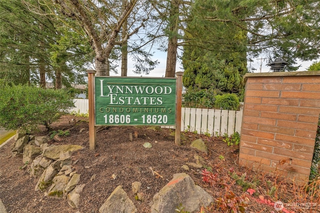 community sign with fence