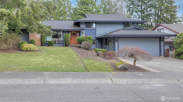 view of front facade with a garage, driveway, a front lawn, and roof with shingles