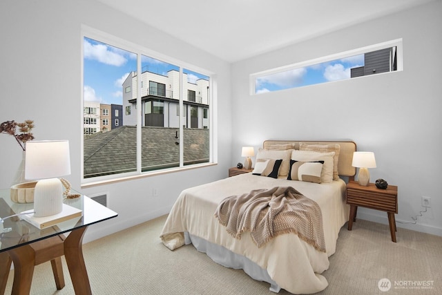 bedroom featuring baseboards and carpet