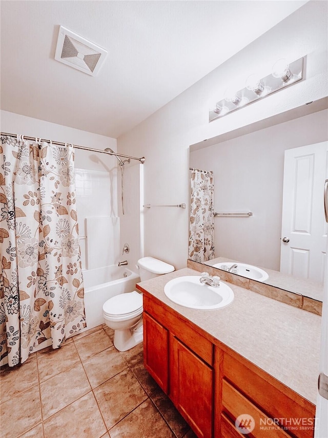 full bath featuring vanity, visible vents, tile patterned flooring, shower / tub combo, and toilet