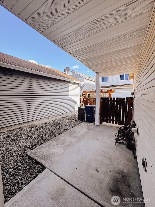 view of patio / terrace featuring fence