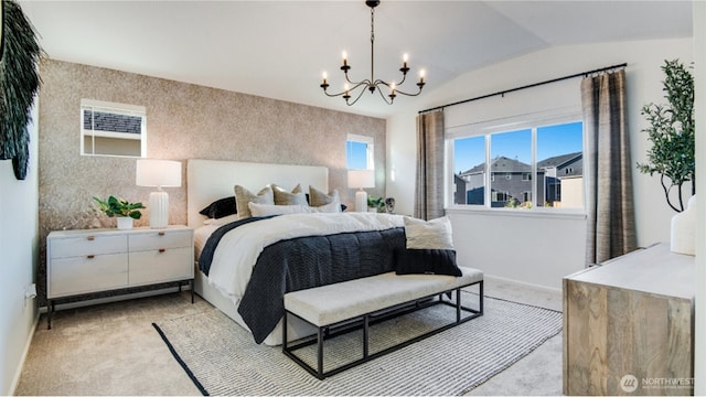 bedroom featuring an accent wall, baseboards, light colored carpet, lofted ceiling, and a notable chandelier