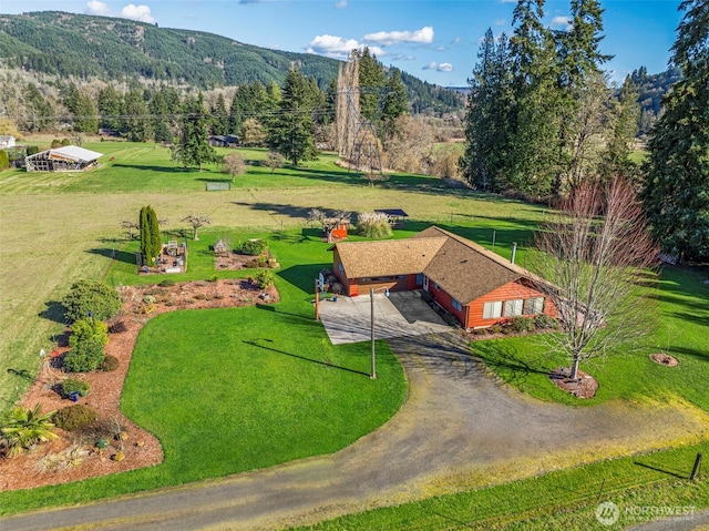 birds eye view of property with a mountain view