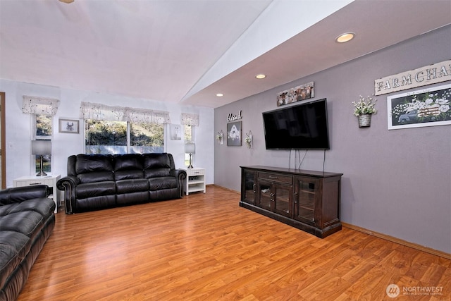 living area with light wood-style flooring, recessed lighting, and baseboards