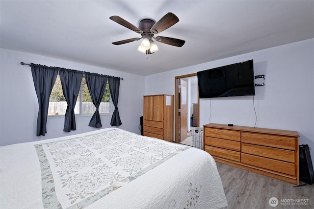 bedroom with a ceiling fan and light wood finished floors