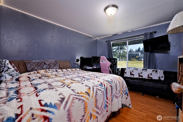 bedroom featuring wood finished floors