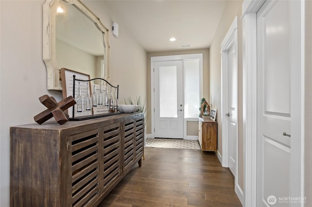 entrance foyer with recessed lighting, visible vents, baseboards, and dark wood-type flooring