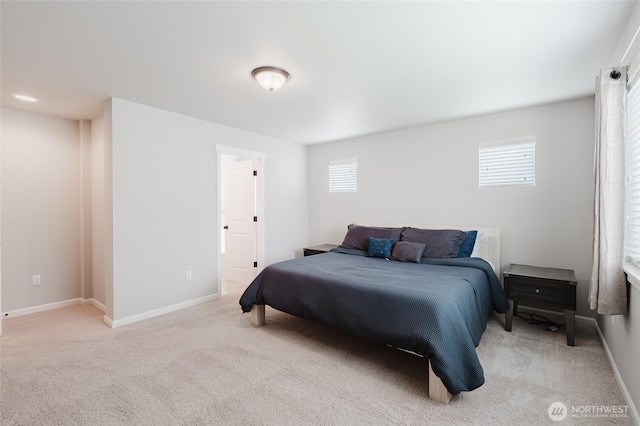 bedroom with carpet flooring and baseboards