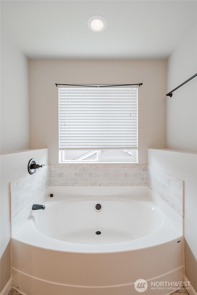 full bath featuring a garden tub