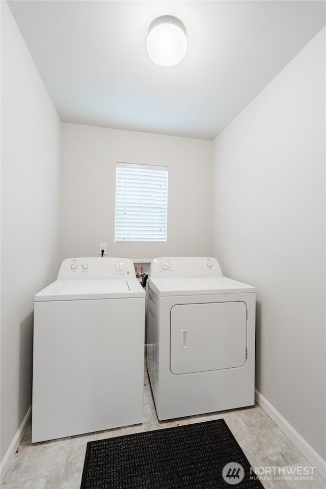 laundry room featuring baseboards, independent washer and dryer, and laundry area